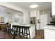 Modern kitchen featuring granite countertops, stainless steel appliances, and bar seating at 409 Courthouse Dr, Morrisville, NC 27560