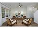 Bright living room features hardwood floors, a neutral color scheme, and large windows at 409 Courthouse Dr, Morrisville, NC 27560