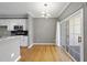 Dining area features modern light fixture and sliding door to the outside at 4210 Brynwood Ave, Durham, NC 27713