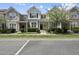 Charming townhouse with well-maintained landscaping, inviting curb appeal, and blossoming trees at 4210 Brynwood Ave, Durham, NC 27713