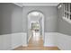Elegant hallway with archway leading to the living room and staircase at 4210 Brynwood Ave, Durham, NC 27713
