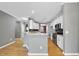Bright kitchen boasts granite counters, stainless steel appliances and white cabinets at 4210 Brynwood Ave, Durham, NC 27713