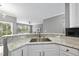 Bright kitchen featuring granite countertops and an open view to the living room at 4210 Brynwood Ave, Durham, NC 27713