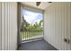 Covered patio offers views of lush greenery and neighborhood at 4210 Brynwood Ave, Durham, NC 27713
