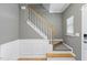 Staircase with white banister and carpeted steps at 4210 Brynwood Ave, Durham, NC 27713