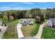 An aerial view of a charming home with a well-manicured lawn, mature trees, and a private driveway at 4304 S Greg Allen Way, Oxford, NC 27565