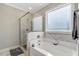 Luxurious bathroom featuring a soaking tub and a glass-enclosed shower at 4304 S Greg Allen Way, Oxford, NC 27565