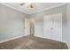 Neutral bedroom with carpet, white trim and an open closet at 4304 S Greg Allen Way, Oxford, NC 27565