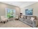 Bonus Room with a large window and a sitting area featuring a plush sofa at 4304 S Greg Allen Way, Oxford, NC 27565