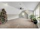Bonus room featuring high ceilings, modern lighting, a ceiling fan, and lots of space at 4304 S Greg Allen Way, Oxford, NC 27565