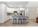 Bright, modern kitchen with stainless steel appliances, granite countertops, and a breakfast bar at 4304 S Greg Allen Way, Oxford, NC 27565