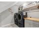 Well-organized laundry room with modern washer and dryer and custom cabinetry at 4304 S Greg Allen Way, Oxford, NC 27565