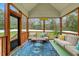 Relaxing screened-in porch with comfortable seating and views of the backyard at 4304 S Greg Allen Way, Oxford, NC 27565