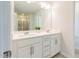 Bathroom features a double sink vanity with a large mirror and a separate shower with glass doors at 501 Willard Woods Dr, Wendell, NC 27591