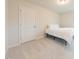 Bedroom with white carpet, a door, and a small bed against the wall at 501 Willard Woods Dr, Wendell, NC 27591