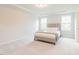 Bright bedroom showcasing a comfortable bed with neutral tones and natural light at 501 Willard Woods Dr, Wendell, NC 27591