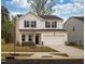 Charming two-story home featuring a two-car garage and stone accents at 501 Willard Woods Dr, Wendell, NC 27591