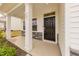 Covered front entry with stylish black door and stone detailing at 501 Willard Woods Dr, Wendell, NC 27591