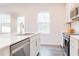 Bright kitchen with stainless steel appliances and a white countertop island with a sink at 501 Willard Woods Dr, Wendell, NC 27591