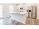 Beautiful kitchen featuring an island with white countertops and stainless steel appliances at 501 Willard Woods Dr, Wendell, NC 27591