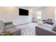 Bright living room showcases a stylish rug and comfortable seating at 501 Willard Woods Dr, Wendell, NC 27591