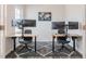 Home office setup with dual monitors and modern furniture on a stylish rug at 501 Willard Woods Dr, Wendell, NC 27591