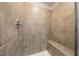 Shower featuring neutral tiles and a built-in bench at 501 Willard Woods Dr, Wendell, NC 27591