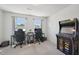 Bedroom with desks, chairs, windows, and a game arcade at 5217 Invention Way, Raleigh, NC 27616