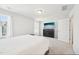 This main bedroom features a large window and a modern dresser with a television at 5217 Invention Way, Raleigh, NC 27616