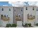 Townhomes featuring private balconies over attached garages and well manicured landscaping at 5217 Invention Way, Raleigh, NC 27616