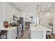 Beautiful kitchen with stainless steel appliances, white cabinets, and a quartz countertop island at 5217 Invention Way, Raleigh, NC 27616