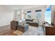 Cozy living room features a large sectional sofa, stylish rug, and plenty of natural light at 5217 Invention Way, Raleigh, NC 27616