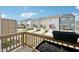 View from balcony showing multiple townhomes with private garages and decks under a bright blue sky at 5217 Invention Way, Raleigh, NC 27616