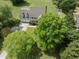 Aerial view of two-story home featuring a spacious backyard and mature trees in a well-kept neighborhood at 5424 Westminster Ln, Fuquay Varina, NC 27526