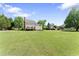 Sprawling backyard featuring a deck and expansive green space at 5424 Westminster Ln, Fuquay Varina, NC 27526