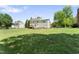 Large, lush backyard with a spacious deck and mature trees, perfect for outdoor enjoyment at 5424 Westminster Ln, Fuquay Varina, NC 27526