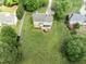 Aerial view of home with spacious backyard featuring a deck and an outdoor stone fire pit at 5424 Westminster Ln, Fuquay Varina, NC 27526