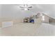 Attic bonus room with carpet, angled walls, ceiling fan, and storage at 5424 Westminster Ln, Fuquay Varina, NC 27526