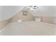 Attic bonus room with carpeted flooring, ceiling fan, and angled walls at 5424 Westminster Ln, Fuquay Varina, NC 27526
