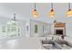 Kitchen sink overlooking the breakfast nook and living room with brick fireplace at 5424 Westminster Ln, Fuquay Varina, NC 27526