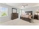 Spacious main bedroom with a ceiling fan and a large window overlooking the side yard at 5424 Westminster Ln, Fuquay Varina, NC 27526
