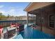 A relaxing back deck with blue floor, screened-in porch, and outdoor seating for enjoying the weather at 556 Rolling Meadows Dr, Clayton, NC 27527