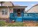 Back deck with screened-in patio, stairs to yard, and landscaping perfect for relaxing or entertaining outdoors at 556 Rolling Meadows Dr, Clayton, NC 27527