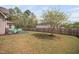 Spacious backyard with a wooden fence, offering ample space and privacy for outdoor activities at 556 Rolling Meadows Dr, Clayton, NC 27527