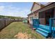 Beautiful backyard featuring a blue deck, privacy fence, lawn and landscaped garden beds at 556 Rolling Meadows Dr, Clayton, NC 27527