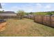 Large backyard with a tree and privacy fence, offering ample space for recreation and relaxation at 556 Rolling Meadows Dr, Clayton, NC 27527