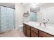 Charming bathroom featuring a shower-tub combination, vanity, framed mirror, and wood-look floors at 556 Rolling Meadows Dr, Clayton, NC 27527