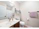 Cozy bathroom featuring wood-look flooring, vanity, and a framed mirror above the sink at 556 Rolling Meadows Dr, Clayton, NC 27527