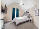 Vaulted bedroom featuring plush carpets, ceiling fan, and large picture window with curtains at 556 Rolling Meadows Dr, Clayton, NC 27527