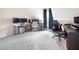 Large bonus room with multiple desks and rolling chairs, perfect for a home office setup at 556 Rolling Meadows Dr, Clayton, NC 27527